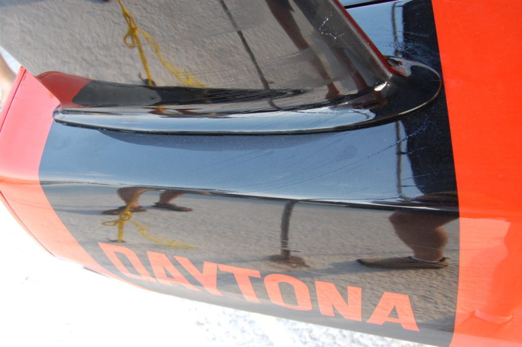 The oil dots on to of the rear quarter panel streaked away from the base of the rear wing pylon, indicating a small zone of airflow separation. This is another example of junction flow separation.