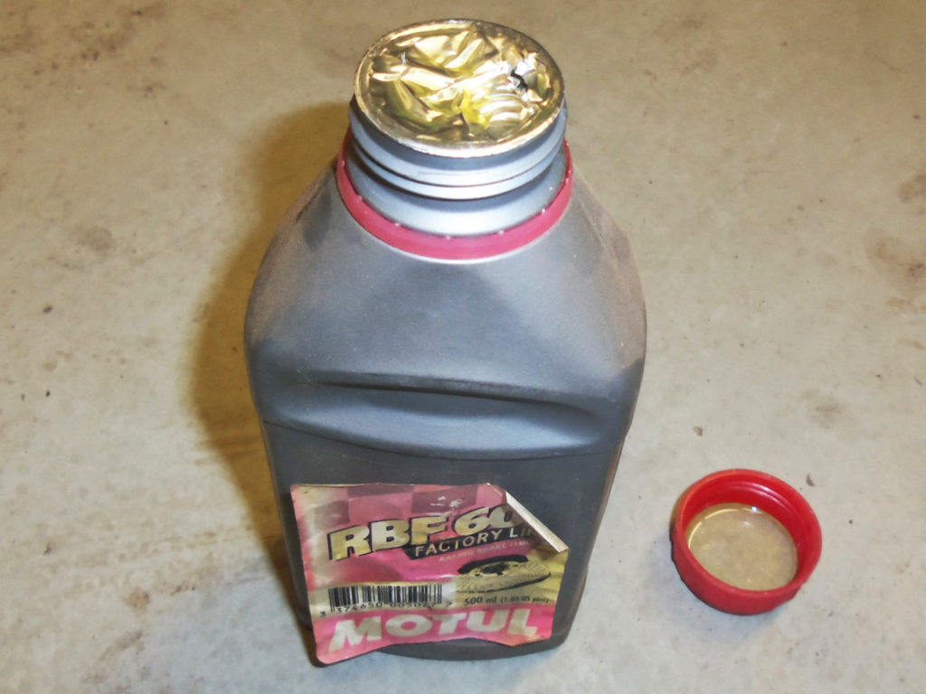 We have all seen this in our race trailer or garage, a really old bottle of brake fluid. There is no way to know how long this bottle has been sitting around, but the aged label says “way too long.” Chances are this bottle of fluid has absorbed more moisture than we would like to have in our racecar’s brake lines.