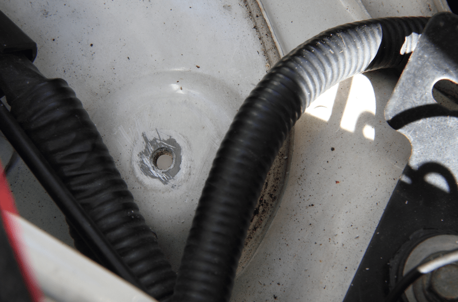 Find a good grounding spot, such as this threaded hole and scrape off the paint so you are getting metal-to-metal contact.