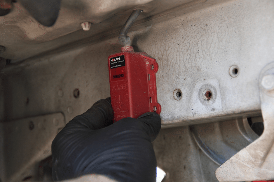 Find a location that allows you to mount the AMB transponder vertically, with a clear shot at the track surface and away from heat that exceeds 122 degrees Fahrenheit. AMB even put an arrow on the unit to make it easy. Mark your holes with a Sharpie, punch dimples and start drilling.