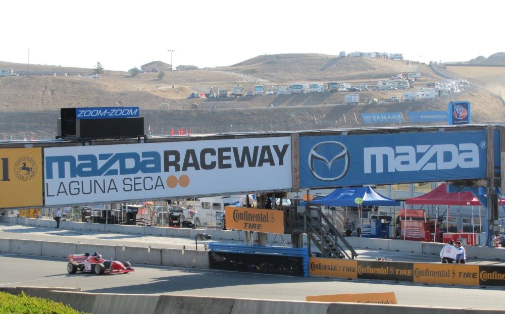 The front straight at Mazda Raceway Laguna Seca is fast and tricky, with a blind rise, then a hard-on-the-brakes downhill scamper into the Andretti Hairpin.