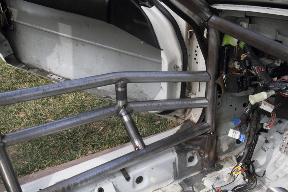 “In a Miata, the rocker is by far the strongest point of the car in terms of where to tie the front legs of the cage to,” Almagor said. “I also go above the rocker and use a wider plate to spread the load and not concentrate it in a small area.”
