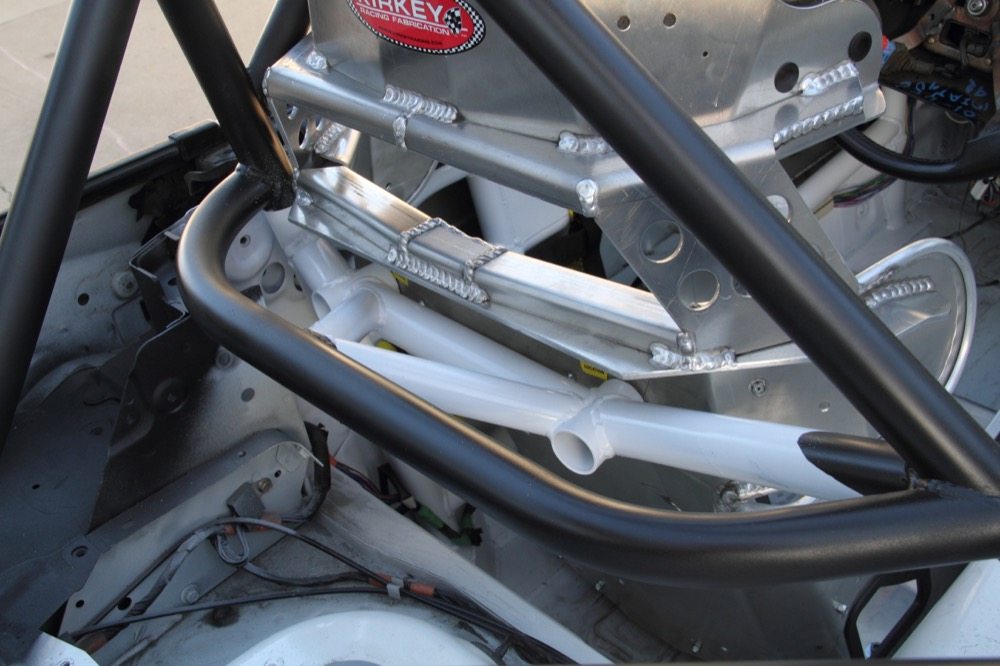 The seat back bolts right to cage. Blind nuts are welded into the open, fore-aft tubes, which mean you don’t have to hold a nut from behind while driving a bolt from the front. 