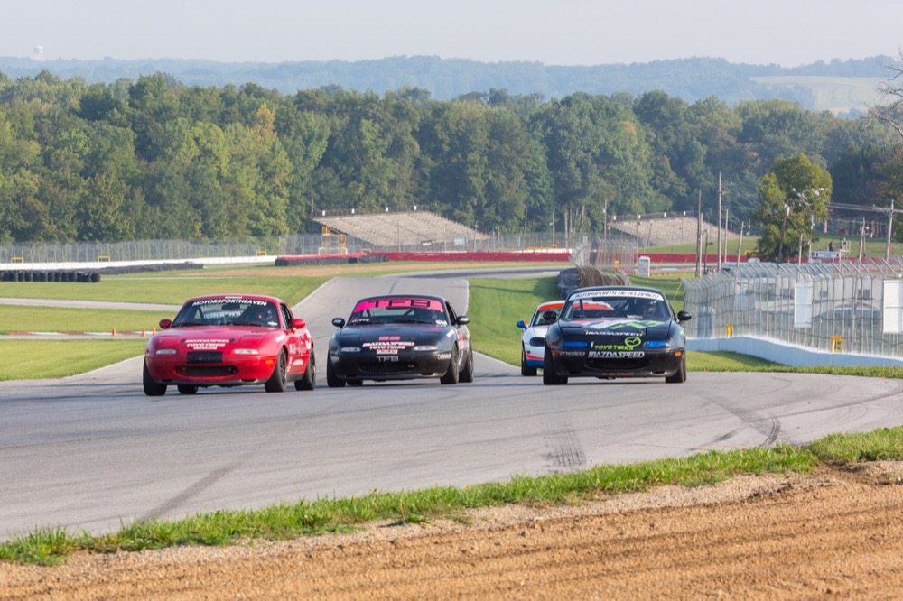 Three wide at corner entry can be dicey, but many tracks are wide enough to do just that. The Keyhole at Mid-Ohio is plenty wide, but the outside can get pretty dirty with rubber “marbles.”