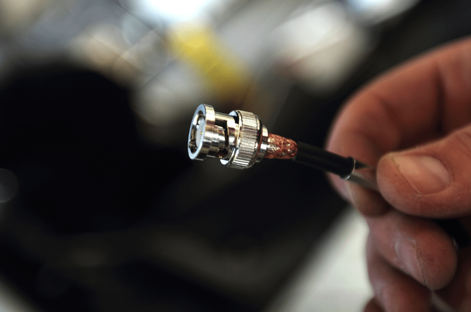 The RG58 cable gets connections from the wire at the core and the mesh beneath the casing. 