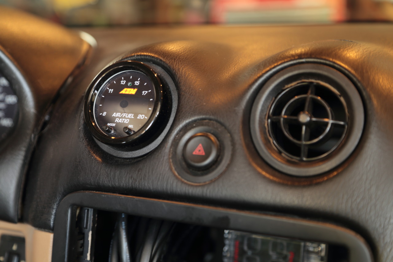 Conveniently, 2 1/16 gauges slip neatly into the air conditioning outlets on Miatas, providing a great spot for the driver to check the gauge quickly on straightaways. 