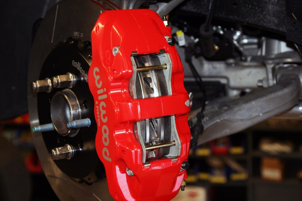 Under the right conditions, aftermarket and OEM calipers alike can be subject to knock-back.