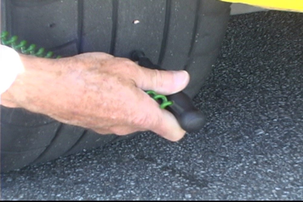 Most tire temperature probes have a needle with stop. The needle should be inserted into the tire tread up to the stop. Hold the probe at approximately a 90-degree angle to the tire surface when inserting the probe into the tread.