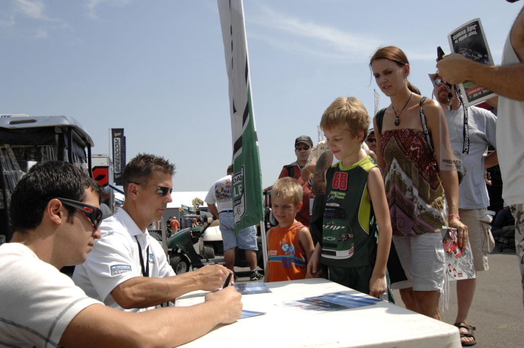 Grand Am drivers sign autographs when the series race at NJMP’s “Thunderbolt” course.