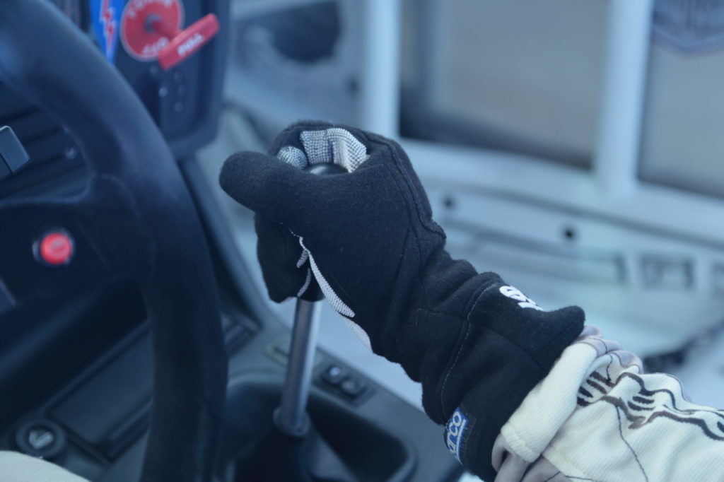 When downshifting, keep your hand in one position: palm on the right side of the shifter with fingers wrapped around the front, thumb on the left side.